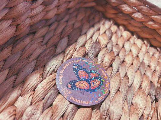 monarch butterfly "keep families together" sticker  |  english and spanish floral holographic sticker (CHIRLA collection)