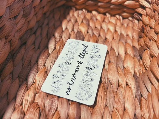 clear "no human is illegal" sticker  |  simple transparent floral sticker (CHIRLA collection)